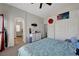 Well-lit bedroom adjacent to an archway for easy access to an ensuite bath at 6433 Buck Jones Ave # 102, Las Vegas, NV 89122