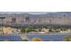 Panoramic city view showcasing buildings and a solar panel array against a mountain backdrop at 6433 Buck Jones Ave # 102, Las Vegas, NV 89122