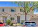 Charming townhouse exterior with well-kept landscaping and inviting entrance at 6433 Buck Jones Ave # 102, Las Vegas, NV 89122