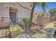 Inviting front entrance features a gray door with a small porch and yellow-trimmed steps at 6433 Buck Jones Ave # 102, Las Vegas, NV 89122