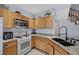 Stylish kitchen features granite countertops, stainless steel appliances, and wooden cabinets at 6433 Buck Jones Ave # 102, Las Vegas, NV 89122