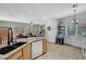 Open kitchen featuring granite counters, light wood cabinets, recessed lights, and stainless steel dishwasher at 6433 Buck Jones Ave # 102, Las Vegas, NV 89122