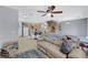 Spacious living area with an open floor plan connecting the kitchen and stairs at 6433 Buck Jones Ave # 102, Las Vegas, NV 89122