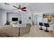 Open-concept living space with a modern kitchen, comfortable seating, and stylish decor at 6433 Buck Jones Ave # 102, Las Vegas, NV 89122