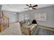 Bright living room features tile flooring, a comfortable sofa, and natural light at 6433 Buck Jones Ave # 102, Las Vegas, NV 89122
