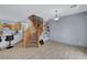Inviting living space with tiled floors, staircase, and an open-concept kitchen at 6433 Buck Jones Ave # 102, Las Vegas, NV 89122