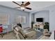 Comfortable living room with a ceiling fan, natural light and a cozy seating area at 6433 Buck Jones Ave # 102, Las Vegas, NV 89122