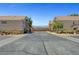A residential street surrounded by well-maintained homes with desert landscaping at 6433 Buck Jones Ave # 102, Las Vegas, NV 89122
