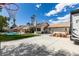 Backyard featuring pool, lawn, mature landscaping, RV parking, and solar panels at 6517 W Brooks Ave, Las Vegas, NV 89108