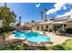 Private backyard oasis featuring a pool, mature landscaping, and patio dining set at 6517 W Brooks Ave, Las Vegas, NV 89108