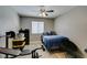 Bedroom with a work out bench, weight rack, and a ceiling fan at 6517 W Brooks Ave, Las Vegas, NV 89108