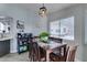A wooden table and chairs are situated in a well lit dining area at 6517 W Brooks Ave, Las Vegas, NV 89108