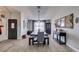 Bright dining area features a long table with bench seating and a stylish chandelier at 6517 W Brooks Ave, Las Vegas, NV 89108