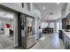 Modern kitchen with stainless steel appliances and open access to the dining area at 6517 W Brooks Ave, Las Vegas, NV 89108