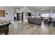 Open-concept living area with tile floors and seamlessly connects to the kitchen and dining spaces at 6517 W Brooks Ave, Las Vegas, NV 89108