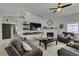 Bright living room features high ceilings, a cozy fireplace, and comfortable seating, perfect for relaxation at 6517 W Brooks Ave, Las Vegas, NV 89108
