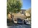 Inviting home featuring a two-car garage, mature shade tree, and neutral stucco exterior at 6531 Goldfield St, North Las Vegas, NV 89084