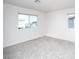 Bright bedroom with large windows and neutral carpet flooring at 7003 Crimson Shadow St, North Las Vegas, NV 89086