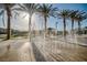 Beautiful community park featuring palm trees and a fun splash pad for residents to enjoy on sunny days at 7003 Crimson Shadow St, North Las Vegas, NV 89086