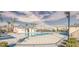Community pool with lounge chairs at 7003 Crimson Shadow St, North Las Vegas, NV 89086