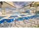 Upscale community pool with plenty of lounge seating and shade umbrellas at 7003 Crimson Shadow St, North Las Vegas, NV 89086