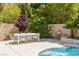 Spacious backyard with a dining area, and lush landscaping perfect for relaxation and entertaining at 712 Proud Eagle Ln, Las Vegas, NV 89144