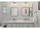 Elegant bathroom with dual sinks, marble countertops, and modern lighting fixtures at 712 Proud Eagle Ln, Las Vegas, NV 89144