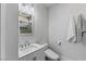 Modern bathroom with sleek vanity, frameless mirror, and luxury toilet at 712 Proud Eagle Ln, Las Vegas, NV 89144