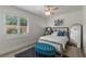 Comfortable bedroom with shuttered windows, ceiling fan, and stylish decor at 712 Proud Eagle Ln, Las Vegas, NV 89144