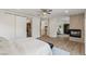 Open bedroom layout with a fireplace, access to the bathroom, and a walk-in closet at 712 Proud Eagle Ln, Las Vegas, NV 89144