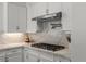 Kitchen features a stainless steel cooktop with stylish countertop and range hood at 712 Proud Eagle Ln, Las Vegas, NV 89144