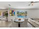 Bright dining area features modern furnishings and lovely views of the sparkling pool at 712 Proud Eagle Ln, Las Vegas, NV 89144