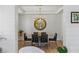 Dining area featuring stylish table, chairs, gold mirror, and modern lighting at 712 Proud Eagle Ln, Las Vegas, NV 89144