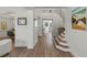 Bright foyer with hardwood flooring, a modern staircase and an open floor plan creates a welcoming entry at 712 Proud Eagle Ln, Las Vegas, NV 89144