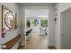 Hallway leading to bright dining room, with views to the pool at 712 Proud Eagle Ln, Las Vegas, NV 89144