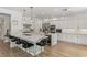 Open-concept kitchen showcases an expansive island, custom cabinets, and modern lighting at 712 Proud Eagle Ln, Las Vegas, NV 89144