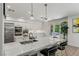 Spacious kitchen boasts a large island, sleek countertops, and stainless steel appliances at 712 Proud Eagle Ln, Las Vegas, NV 89144