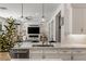 Modern kitchen showcasing quartz countertops, stainless steel appliances, and stylish pendant lighting at 712 Proud Eagle Ln, Las Vegas, NV 89144