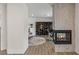 Cozy living area features a modern fireplace, office space, and access to other rooms at 712 Proud Eagle Ln, Las Vegas, NV 89144