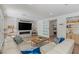 Comfortable living room with modern fireplace, TV, and access to a wet bar at 712 Proud Eagle Ln, Las Vegas, NV 89144