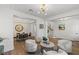 Open-concept living and dining area, with modern decor, open staircase at 712 Proud Eagle Ln, Las Vegas, NV 89144