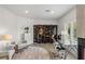 Bright office space with natural light, a glass desk, and decor at 712 Proud Eagle Ln, Las Vegas, NV 89144