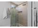 Walk-in shower with large shower head and pebble floor at 712 Proud Eagle Ln, Las Vegas, NV 89144