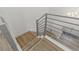 Modern staircase with sleek metal railings and light wood treads leading to the upper level at 712 Proud Eagle Ln, Las Vegas, NV 89144