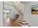 Modern staircase with wood treads and stainless steel railings at 712 Proud Eagle Ln, Las Vegas, NV 89144