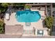 Aerial view of the pool area, complete with an outdoor kitchen and shaded dining at 712 Proud Eagle Ln, Las Vegas, NV 89144