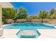 Swimming pool with a water feature and tiled center at 712 Proud Eagle Ln, Las Vegas, NV 89144