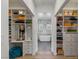 Spacious walk-in closet with custom shelving that leads to a luxurious marble bathroom at 712 Proud Eagle Ln, Las Vegas, NV 89144
