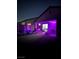 Cozy outdoor backyard with a playground, ample grass, and overhead string lights at 740 Omaggio Pl, Henderson, NV 89011