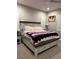 Inviting main bedroom with a queen sized bed, neutral paint, and a ceiling fan at 740 Omaggio Pl, Henderson, NV 89011